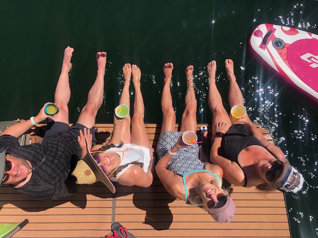 Four People Tanning on Sun Deck at Vallecito Lake on Boat Charter